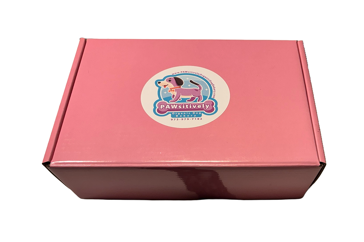 Organic gourmet dog bakery subscription box with handmade treats inside.