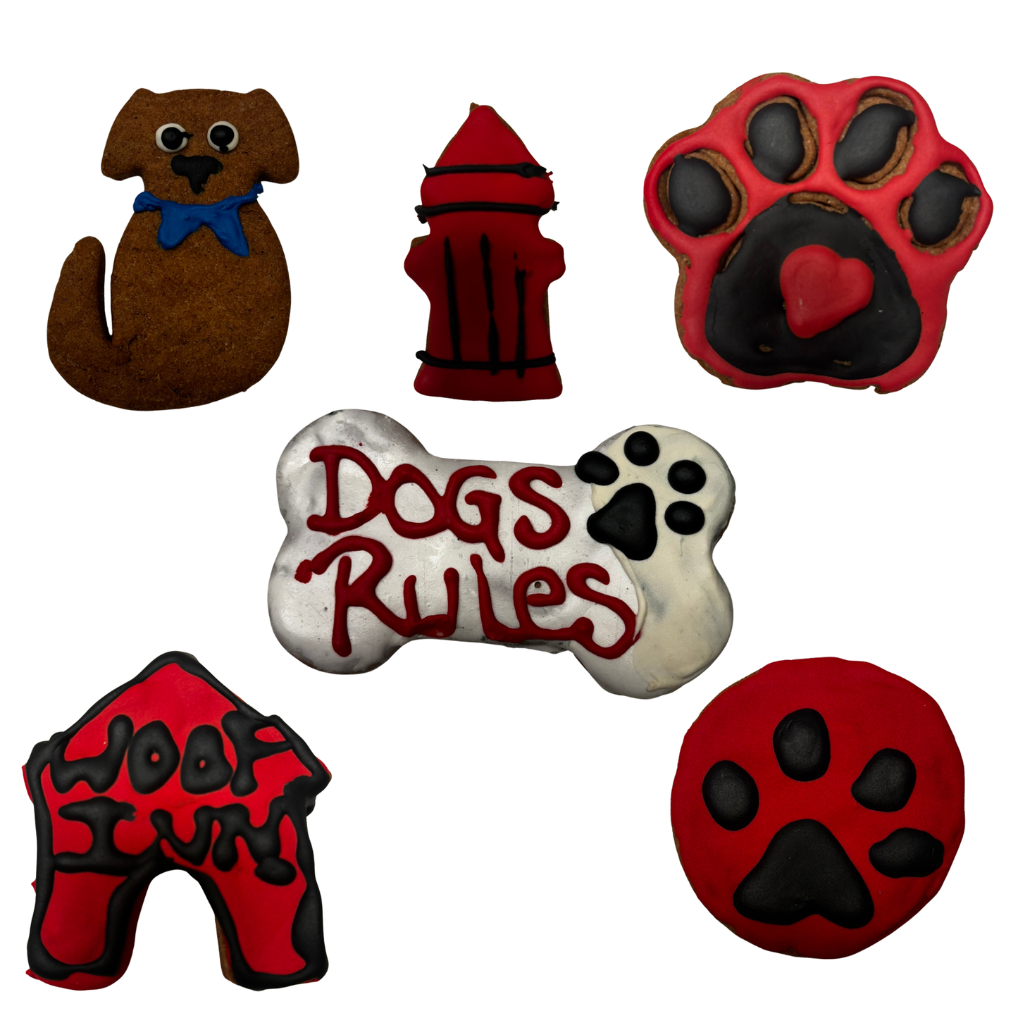 Assorted handmade organic dog cookies on white background, featuring dog bone with “Dogs Rule,” paw print cookies, and themed dog-shaped treats