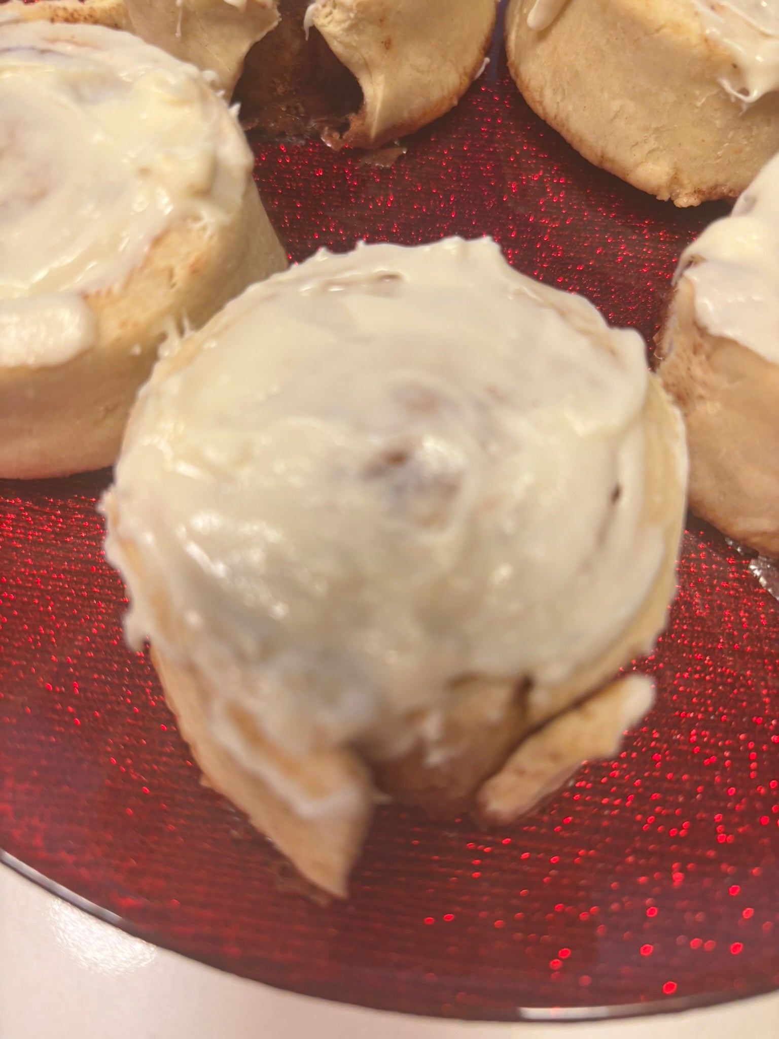 cinnamon bun-shaped organic dog treats with icing on top, delicious and sweet.