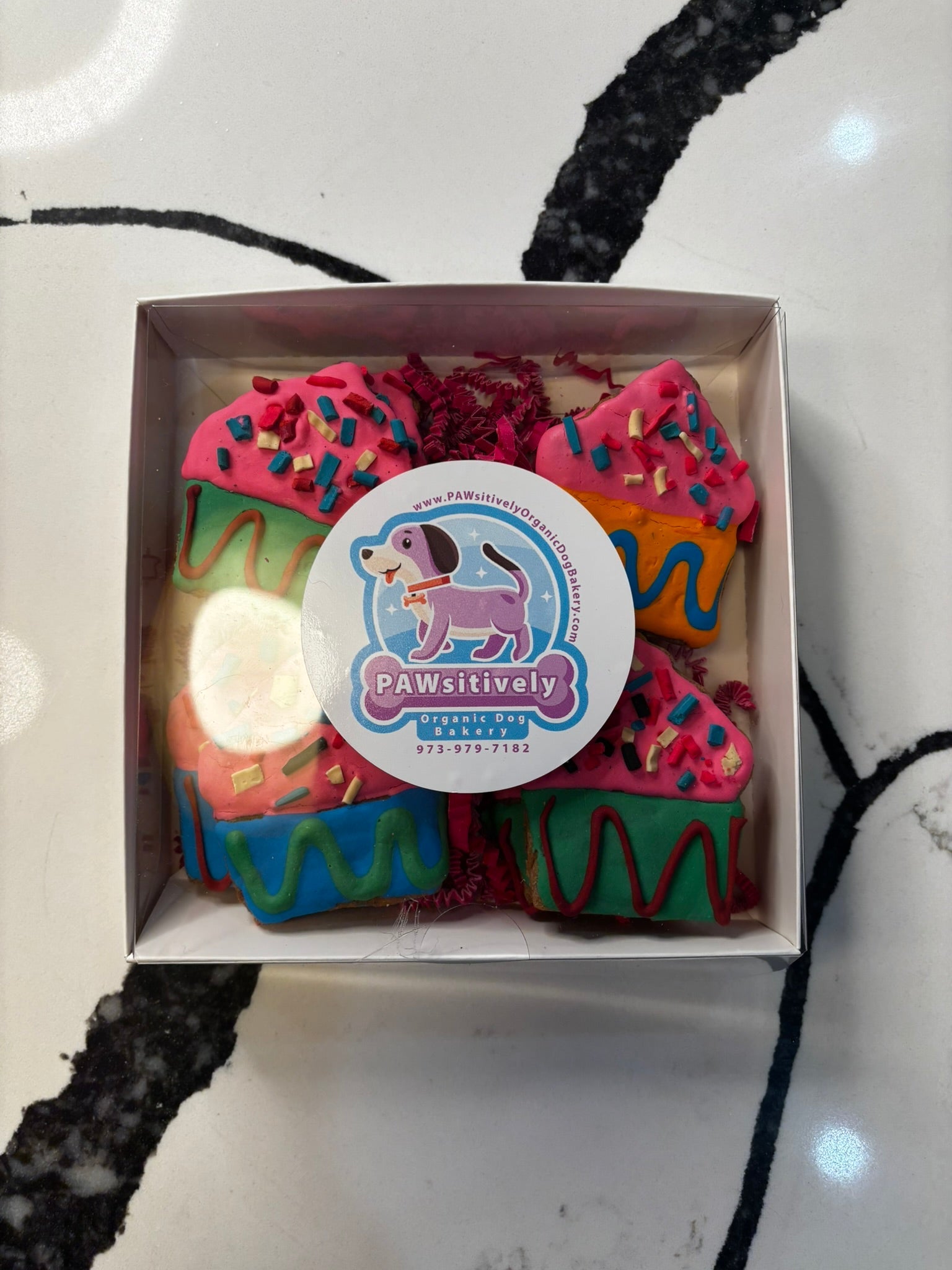 colorful bakery style dog treats with icing and sprinkles handmade organic