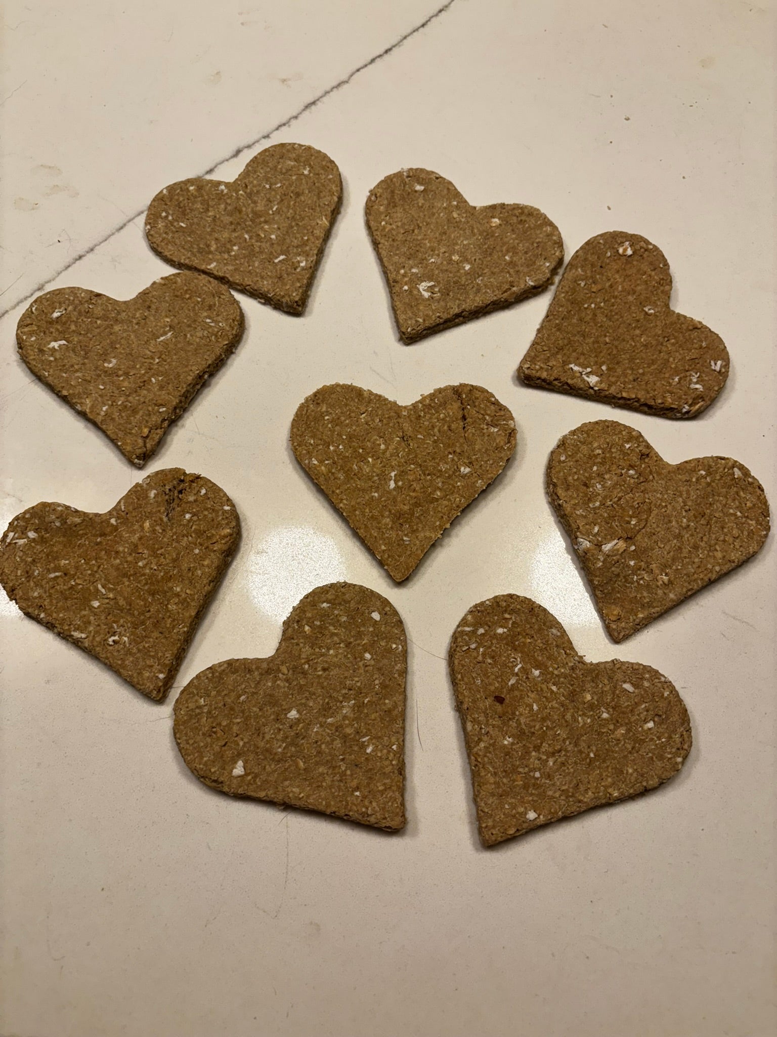 Close-up of natural organic dog biscuits with oats and pear ingredients