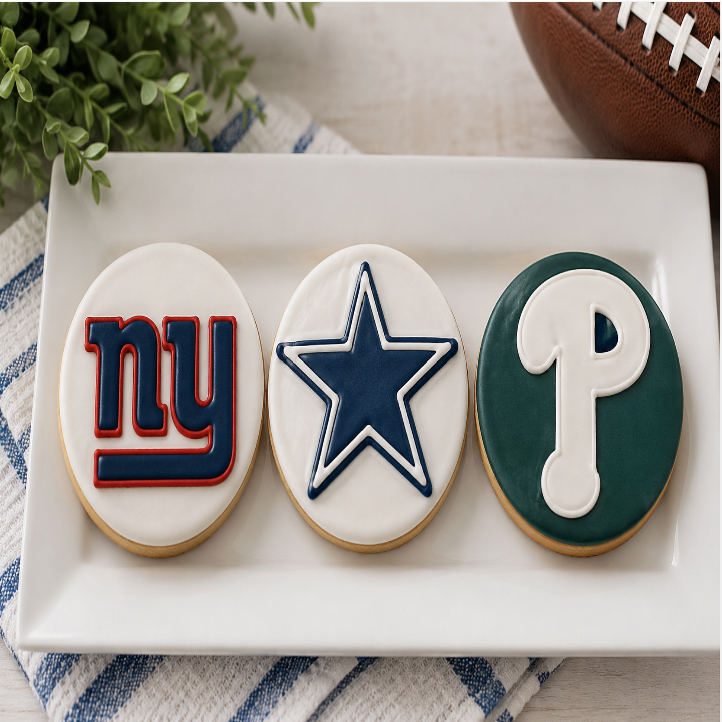 Assorted NFL-inspired organic dog cookies featuring Philadelphia Eagles, Dallas Cowboys, and New York Giants team designs, handcrafted with organic peanut butter and decorated in official team colors. 🏈🐾
